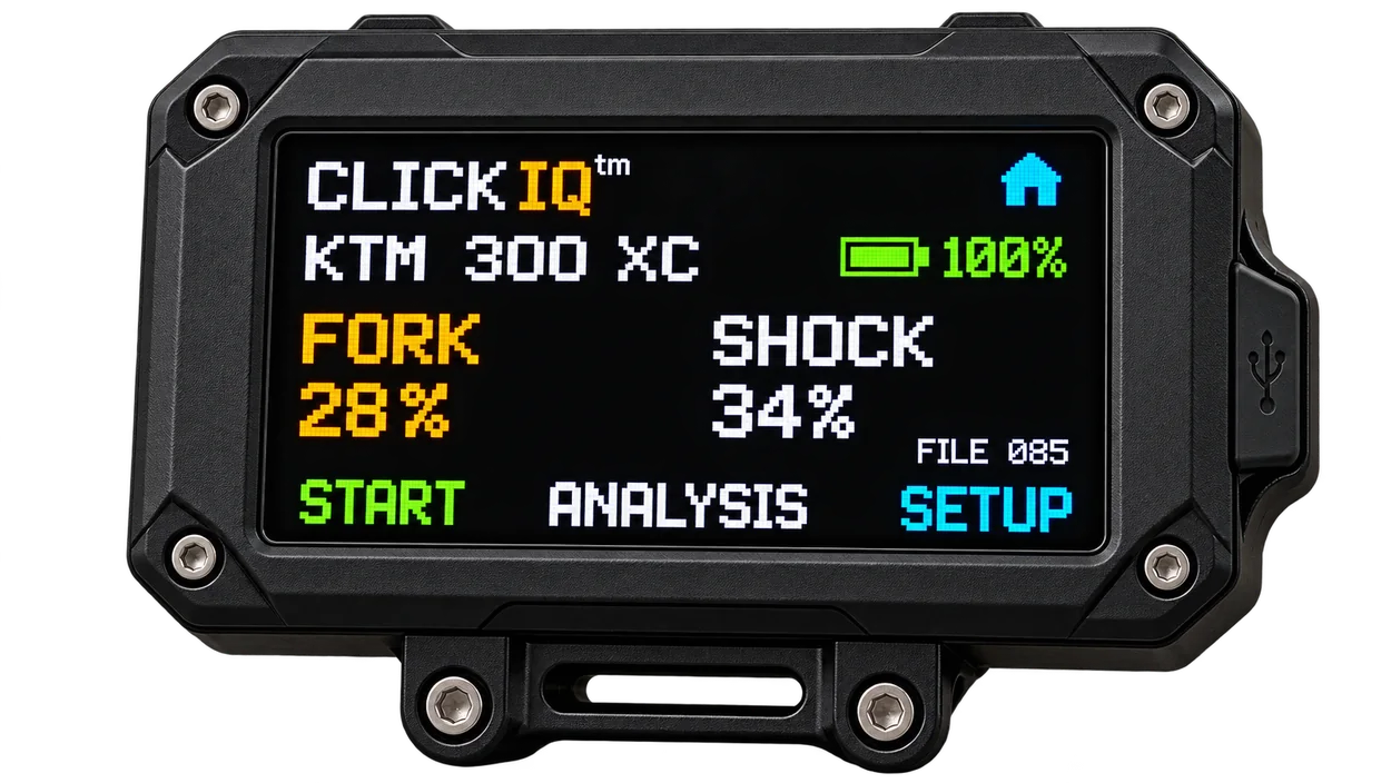 Concept of the ClickIQ color touchscreen within a rugged black enclosure, showing the KTM 300 XC bike profile, fork and shock readings, and recording controls.